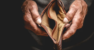 Person displaying an open faced empty wallet